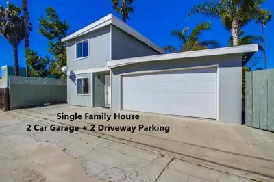 a house with a garage and a driveway parked at Endless Summer 2 in San Diego