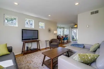 a living room with a couch and a flat screen tv at Endless Summer 2 in San Diego