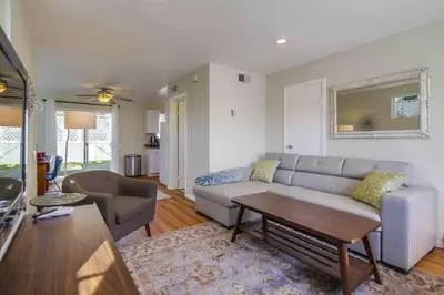 a living room with a couch and a table at Endless Summer 2 in San Diego