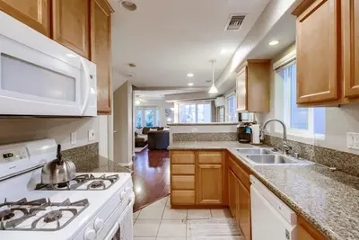 a kitchen with a stove and a sink at Palms Paradise 2 in San Diego