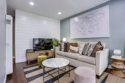 a living room with a couch and a tv at Bayside Bikini 1 in San Diego