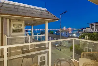 a house with a balcony with a view of the ocean at Bay View in San Diego
