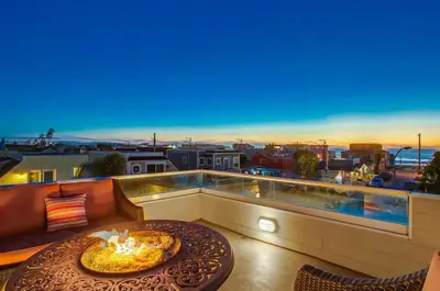 a pizza sitting on a table on a balcony at Bay View in San Diego
