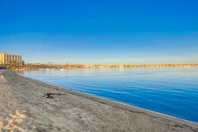 a view of a body of water with buildings in the background at Bay View in San Diego