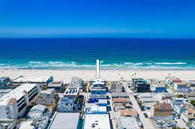 an aerial view of a beach with buildings and the ocean at Surf Style 3 in San Diego