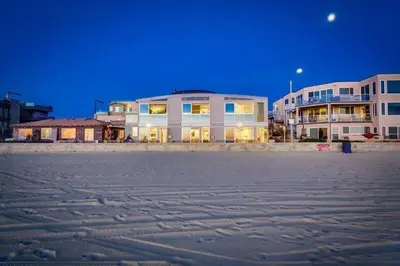 a building on the beach at night at Surf Style 3 in San Diego