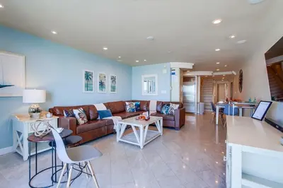 a living room with a couch and a table at Residence Club 3 in San Diego