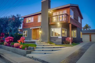 a house with a staircase in front of it at Windansea 1 in San Diego