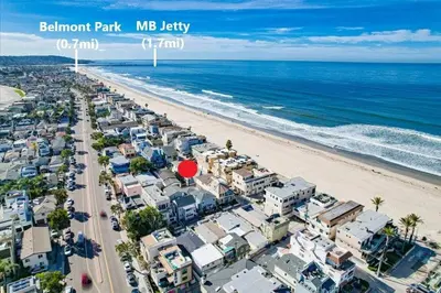 an aerial view of a beach with buildings and the ocean at Strandway Suite 3 in San Diego