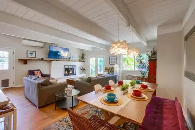 a living room with a table and a couch at Endless Summer 1 in San Diego