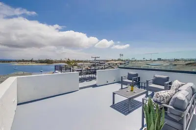 a balcony with a view of the water on a building at Kennebeck Cove in San Diego