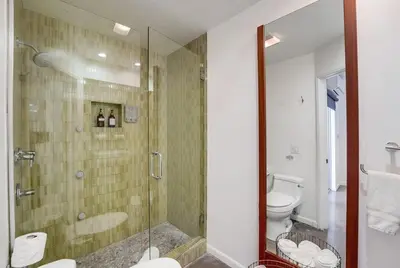 a bathroom with a glass shower and a toilet at Kettner Row 1 in San Diego