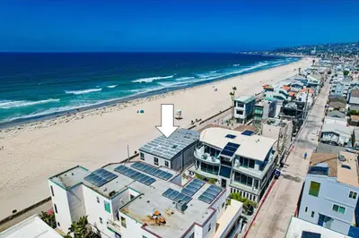 an aerial view of a beach with buildings and the ocean at Surf Style 1 in San Diego