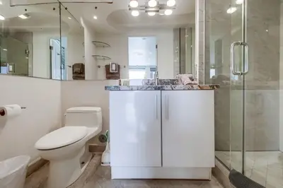 a bathroom with a toilet and a sink and a shower at Surf Style 1 in San Diego