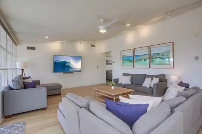 a living room with a couch and a table at Treasure Villa in San Diego