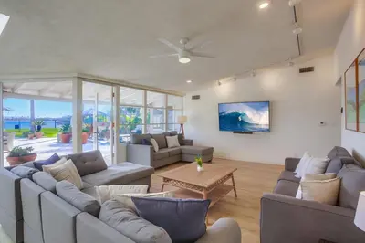 a living room with couches and a table at Treasure Villa in San Diego