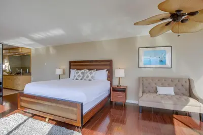 a bedroom with a bed and a ceiling fan at Waterfront 4 in San Diego