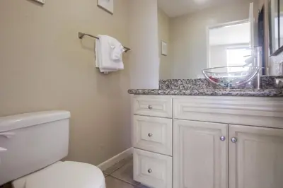 a bathroom with a white toilet and a sink at Waterfront 4 in San Diego