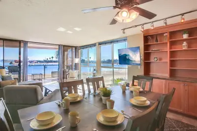 a dining room with a table and a view of the water at Waterfront 4 in San Diego