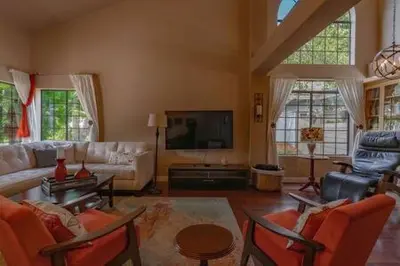 a living room with a couch and a tv at Escape to Carmel Valley Tranquil Outdoor Space in San Diego