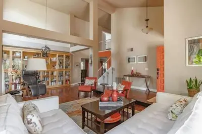 a living room with a white couch and a table at Escape to Carmel Valley Tranquil Outdoor Space in San Diego