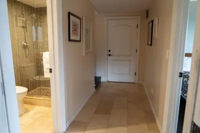 a hallway with a bathroom with a shower and a toilet at Stunning Home & Spectacular View in La Mesa