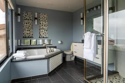 a bathroom with a tub and a shower and a toilet at Stunning Home & Spectacular View in La Mesa