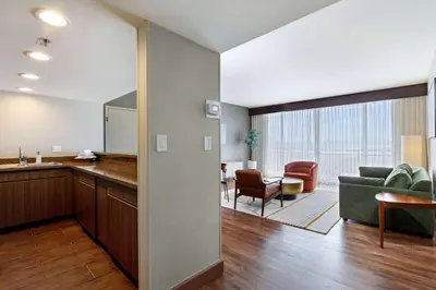 a kitchen and living room with a couch and a table at Wyndham San Diego Bayside in San Diego
