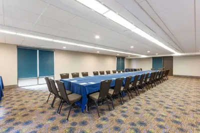 a large conference room with a long table and chairs at Wyndham San Diego Bayside in San Diego