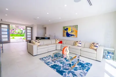 a living room with a couch and a table at La Jolla Paradise with Ocean Views Pool and Spa in San Diego