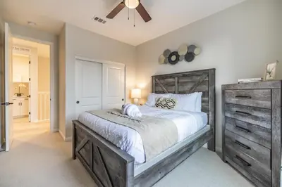 a bedroom with a large bed and a ceiling fan at #Marbella Lane - Elegant 5BR Home Rancho Mission in Ladera Ranch