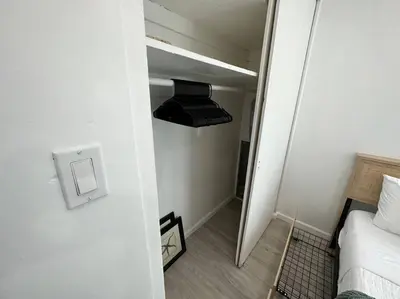a hallway with a room with a bed and a lightswitch at Beachside 2BR close 2 sand, town in Laguna Beach