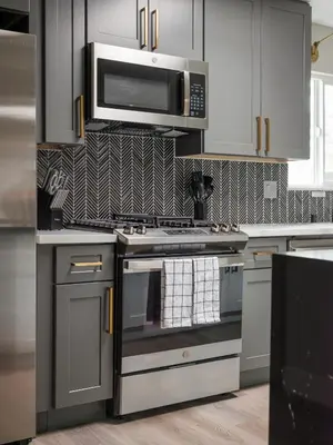 a kitchen with a stove and a microwave at Peaceful 4br with Fire Pit and Huge Yard in San Diego
