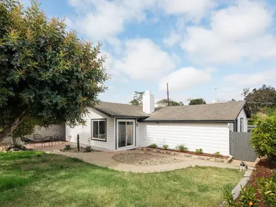 a white house with a yard at Peaceful 4br with Fire Pit and Huge Yard in San Diego