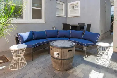 a blue couch and two chairs and a table at 4048 Stylish condo in Hillcrest Mission Hills in San Diego