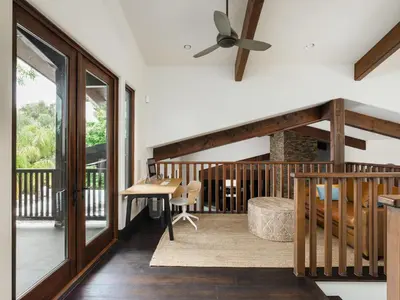 a balcony with a table and a ceiling fan at Private Resort in Lake Hodges in Escondido