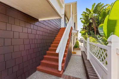 a staircase leading up to a house with red bricks at Stunning BayVIEW Home with Epic Waterfront Views! in Newport Beach