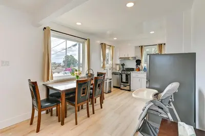 a kitchen and dining room with a table and chairs at Sunny San Diego Home with Private Yard and Grill! in San Diego
