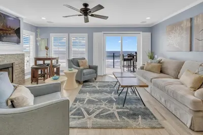 a living room with a couch and a table at Seaview 1135A in Oceanside