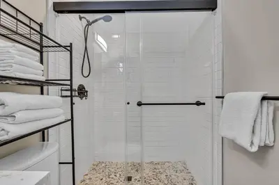 a shower with a glass door in a bathroom at Tower 9 F in Oceanside
