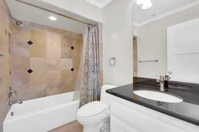 a bathroom with a toilet and a sink and a shower at Seaview 1133A in Oceanside