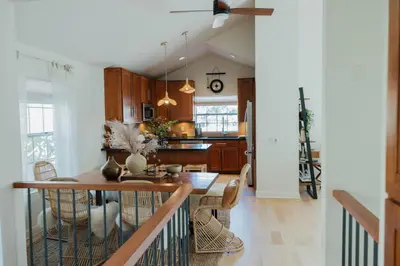 a kitchen and dining room with a table and chairs at Stylish PB Townhome, Walk to Bay, and Balcony in San Diego