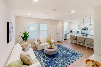 a living room with a couch and a table at Leucadia Stonesteps Retreat in Encinitas