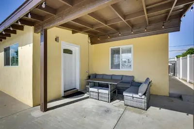 a patio with a bench and a table and chairs at Centrally Located Retreat 5 Mi to San Diego Zoo! in San Diego