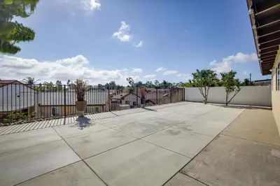 an empty patio with a fence and trees at Centrally Located Retreat 5 Mi to San Diego Zoo! in San Diego