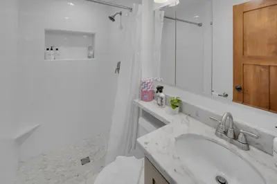 a white bathroom with a sink and a shower at Near All Things SD - Canyonview - Jacuzzi - EV Charge in San Diego