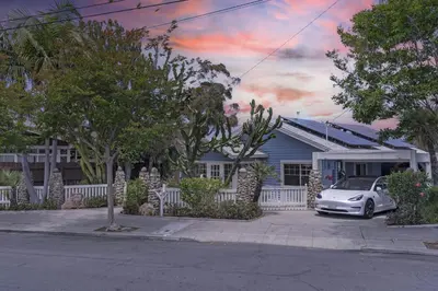 a white car parked in front of a house at Near All Things SD - Canyonview - Jacuzzi - EV Charge in San Diego