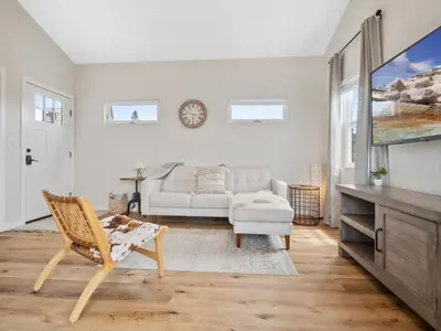a living room with a couch and a chair at A4609b- Sunset Cliffs Dream Apartment in San Diego