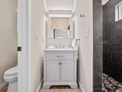 a bathroom with a sink and a toilet at A4609b- Sunset Cliffs Dream Apartment in San Diego