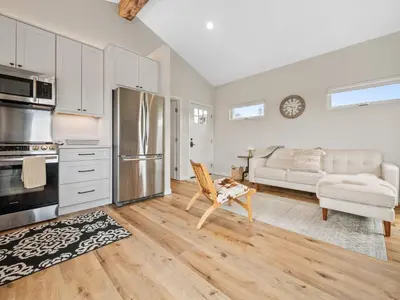 a kitchen and living room with a refrigerator and a couch at A4609b- Sunset Cliffs Dream Apartment in San Diego